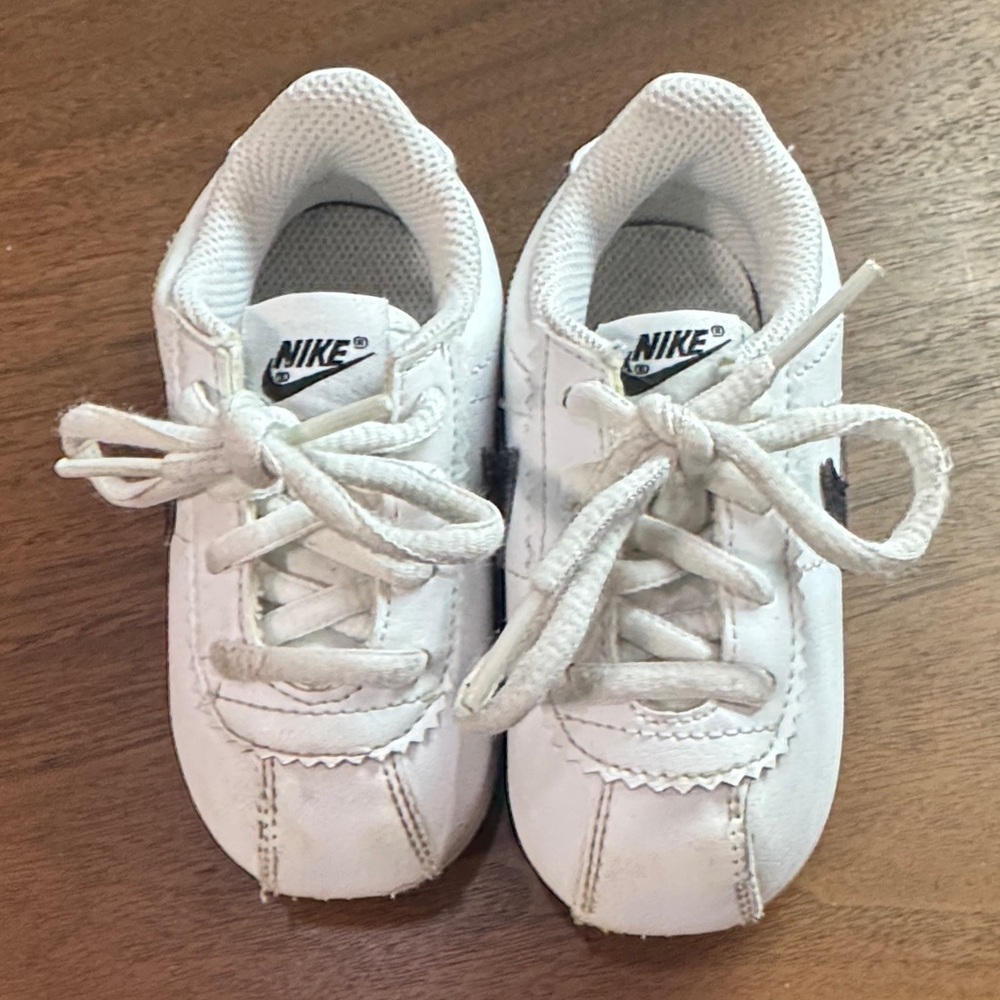 Nike Kids White Sneakers with Black Swoosh